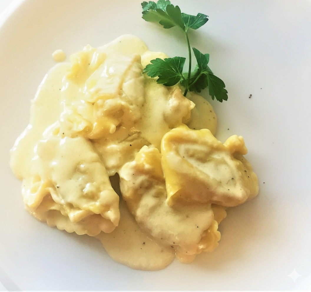 Tortelloni ricotta e prezzemolo con crema di parmigiano