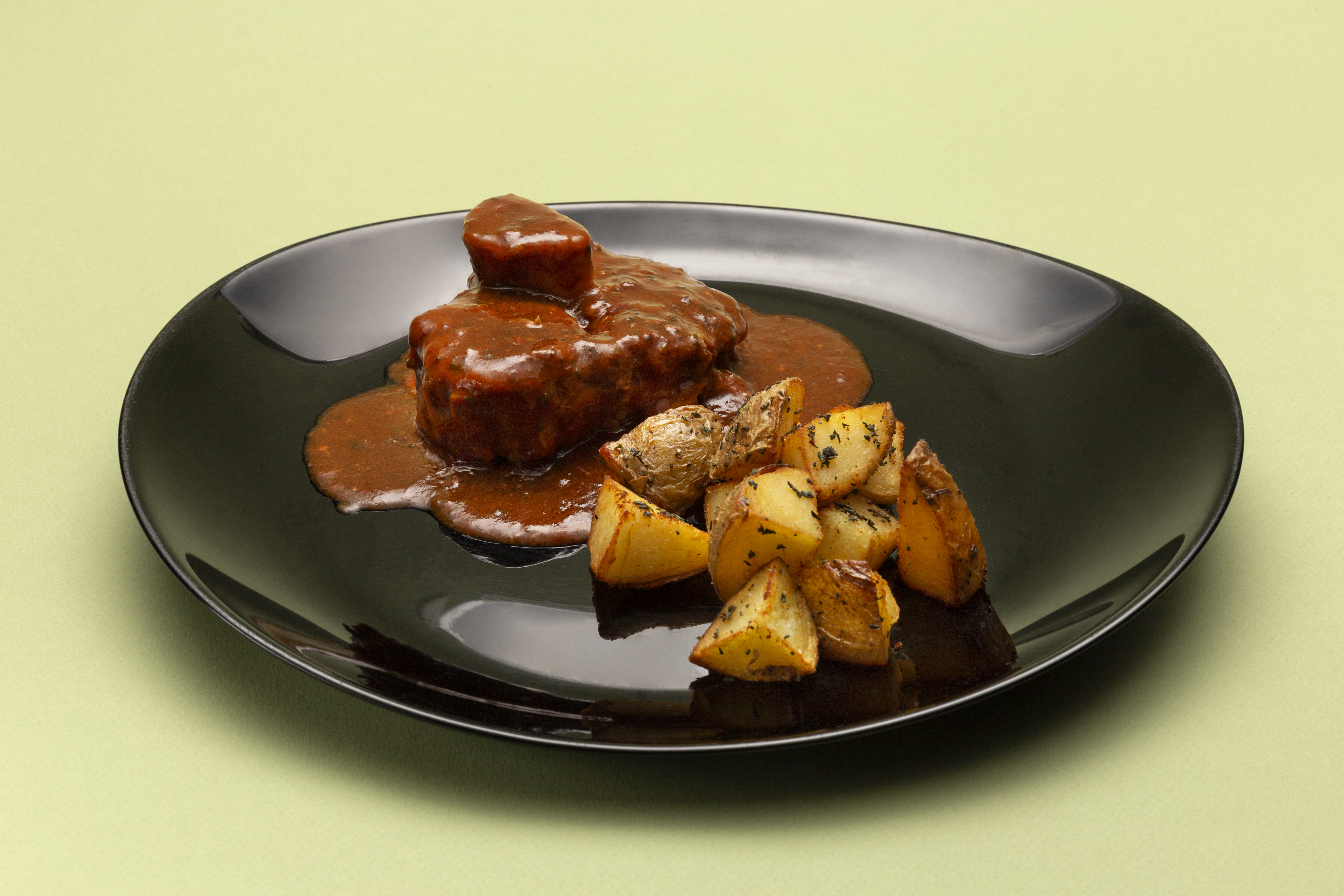 Ossobuco di vitello in gremolada con patate al forno