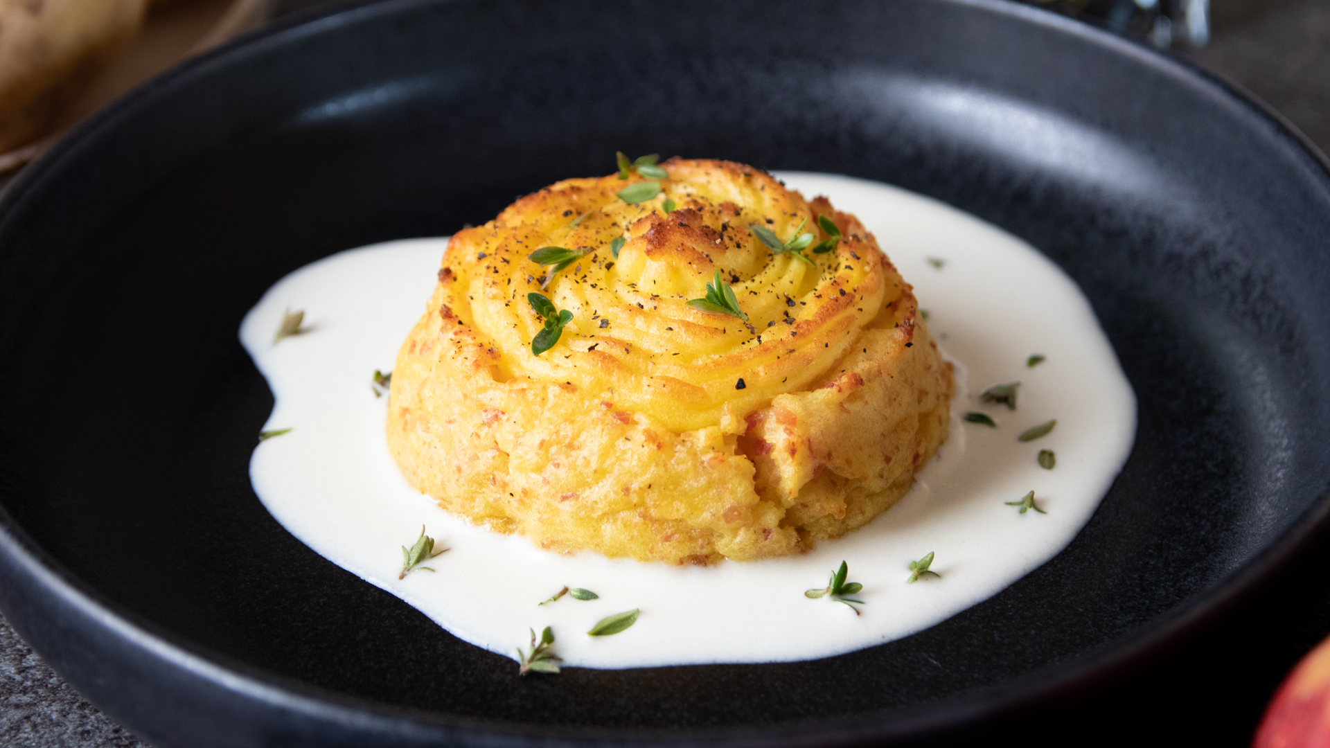 Tortino di patate con fonduta di parmigiano e noci